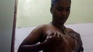 Tamil babe soaping up her bare tits in a steamy bathroom MMS clip