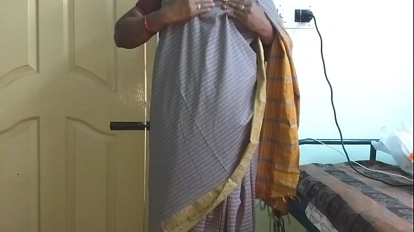 Desi Indian wife Vanitha in grey saree reveals massive tits and shaved pussy, fingering herself while squeezing her hard nipples