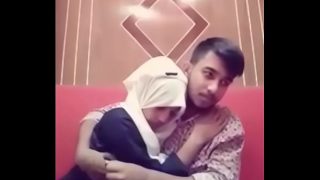 Desi couple getting hot and heavy in a hotel room, tongues tangled and clothes coming off