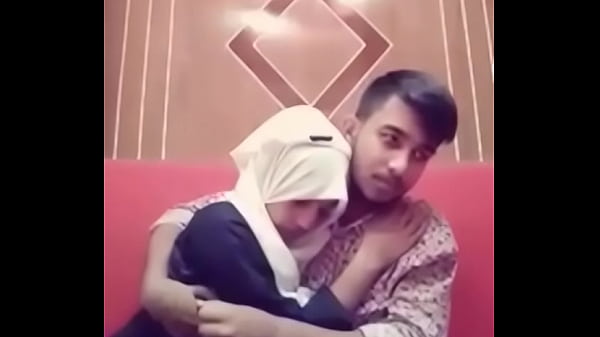 Desi couple getting hot and heavy in a hotel room, tongues tangled and clothes coming off