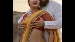Hot desi bhabhi in saree, squeezing her tits for steamy romance