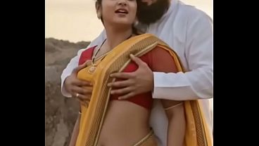 Hot desi bhabhi in saree, squeezing her tits for steamy romance