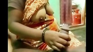 Indian aunty jerking off a young boy’s cock